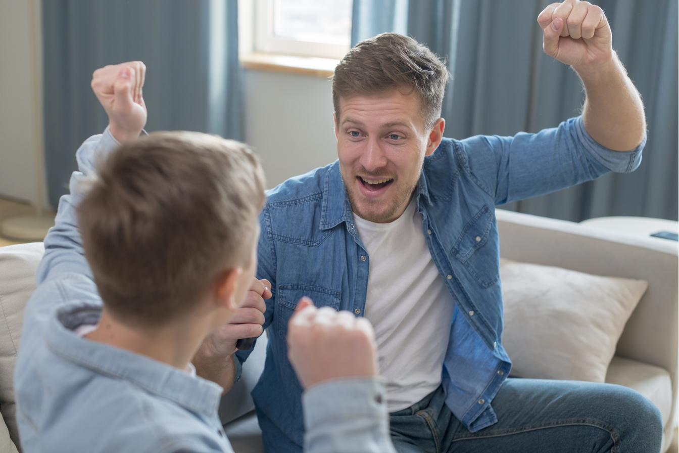 A parent and child celebrating a milestone together