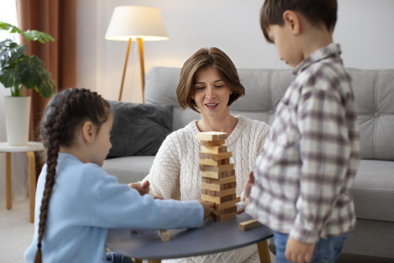 A support worker playing and engaging with children