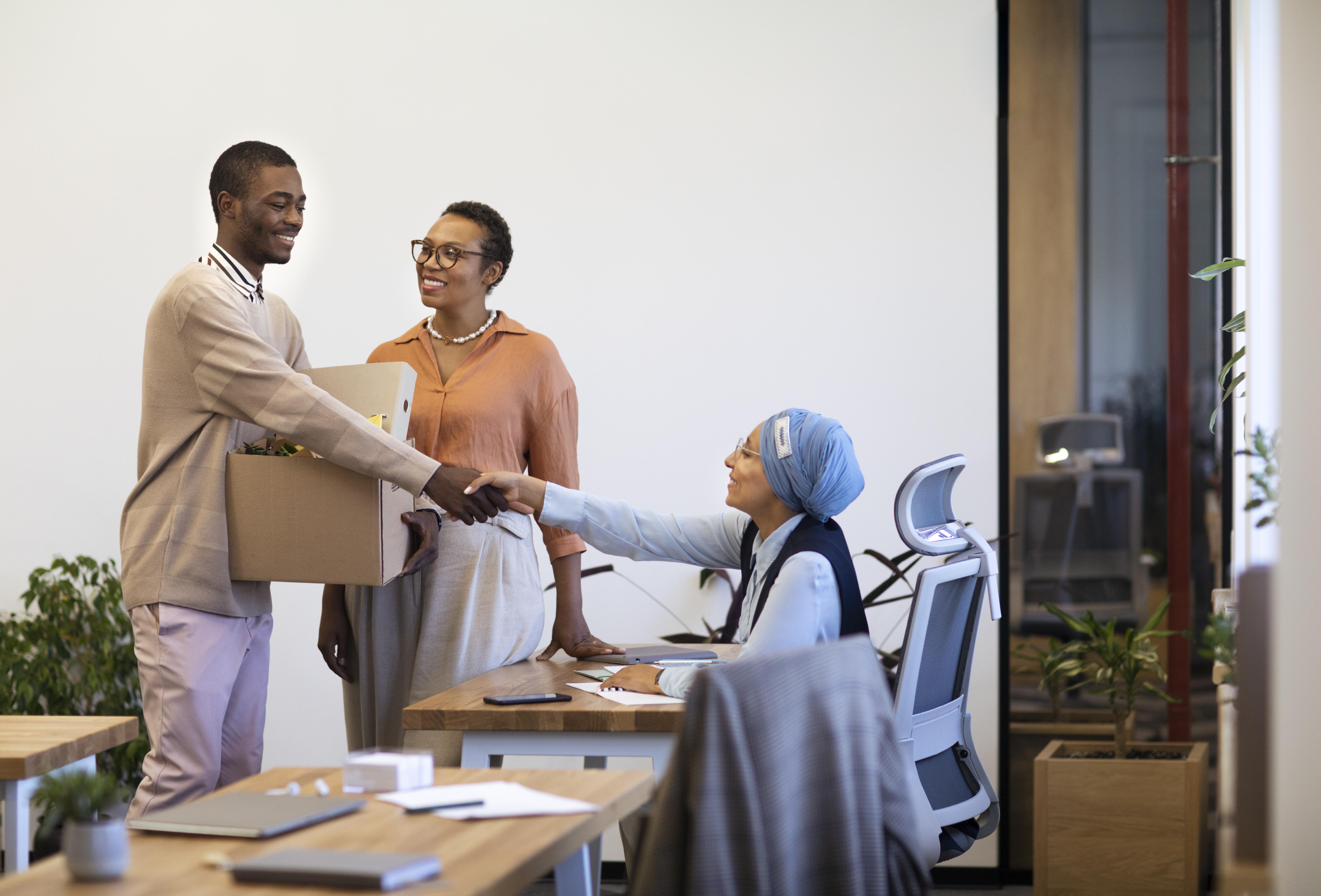 A young person being welcomed to their new workplace